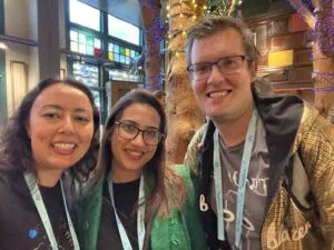 Three people smiling on a picture at a breakfast meeting in San Francisco including Thomas Theunen and Amalia Murray.