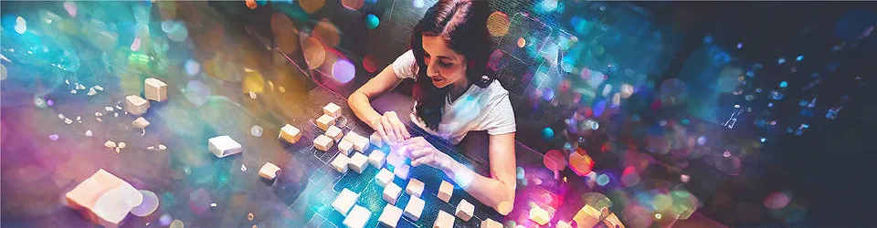 A woman combining different blocks in a particular order.